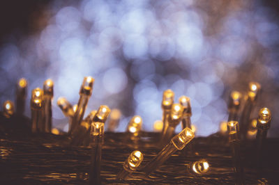 Close-up of illuminated lighting equipment on table