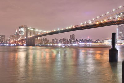 Illuminated city at waterfront