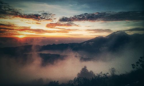 Scenic view of silhouette trees against sky during sunset