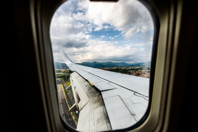 View of landscape seen through airplane window