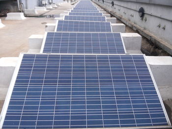 High angle view of solar panels on building terrace