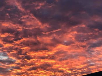 Low angle view of dramatic sky during sunset