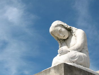 Low angle view of statue against sky