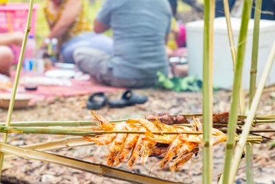 Low section of person working at market stall