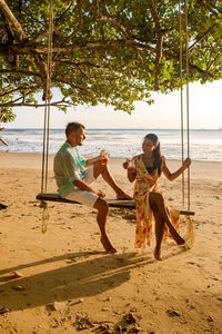 Men sitting on beach