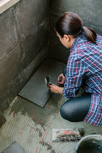 High angle view of woman using mobile phone