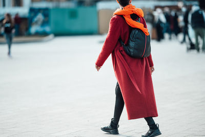 Rear view of woman walking on street