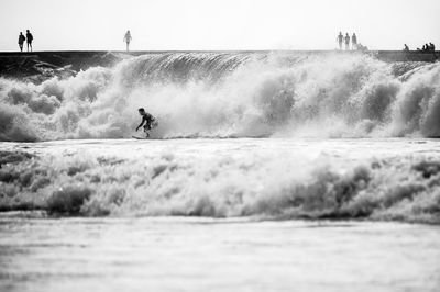 Man surfing on sea