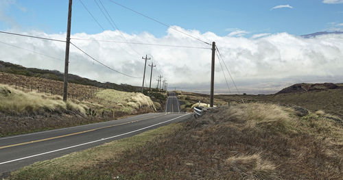 Scenic view of mountain road against sky