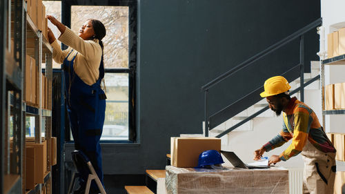 Side view of man working at construction site