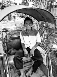 Portrait of man sitting outdoors