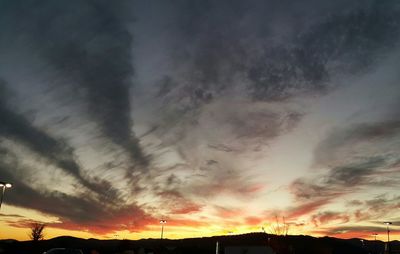 Low angle view of cloudy sky at sunset