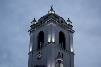 Low angle view of church and building against sky