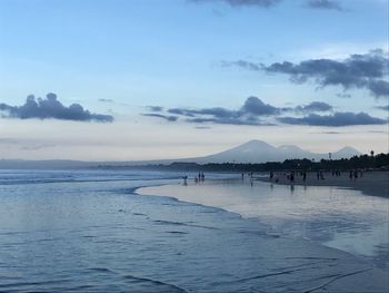 Scenic view of beach against sky during sunset