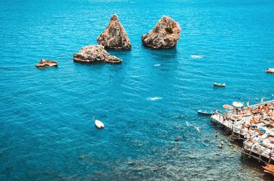 High angle view of rocks in sea