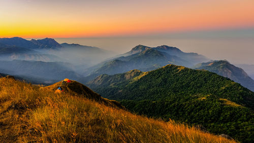 Scenic view of mountains against sky during sunset