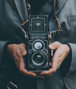 Midsection of man photographing