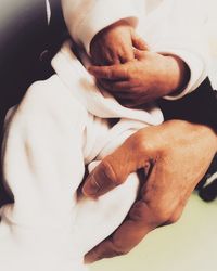 Close-up of couple holding hands