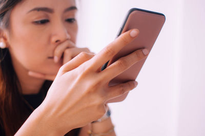 Midsection of woman using mobile phone