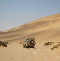 View of desert against clear sky