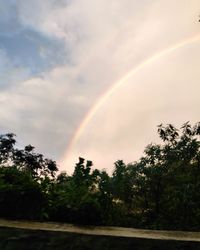 Low angle view of rainbow against sky