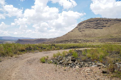 Dirt road against a mountain background, menengai crater, nakuru county, rift valley, kenya