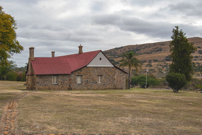 House on field against sky