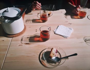 Close-up of food and drink on wooden table