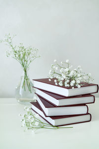 Close-up of white flower vase on table