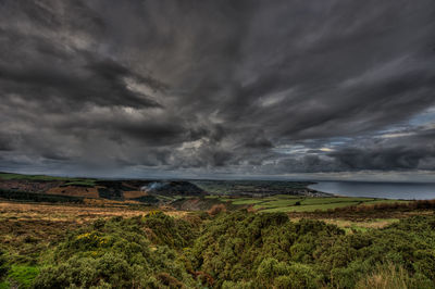 Scenic view of storm clouds over sea