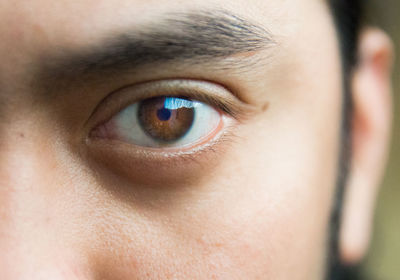 Close-up portrait of man with brown eyes