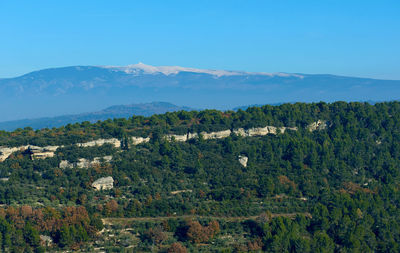 Scenic view of tree mountains against sky