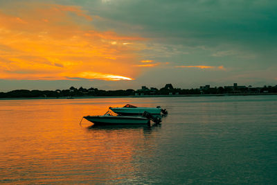 Scenic view boats at shela beach at sunset in lamu town, unesco world heritage site in kenya