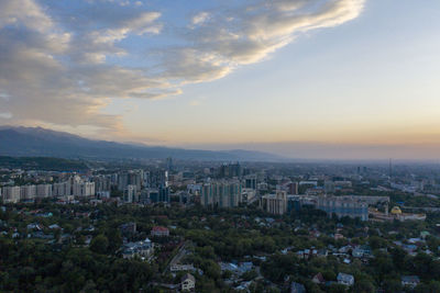 High angle view of buildings against sky during sunset