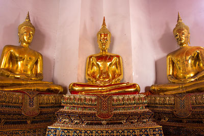 Buddha statue in temple outside building