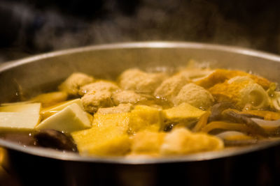 Close-up of meat in cooking pan