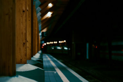 Illuminated fence in dark