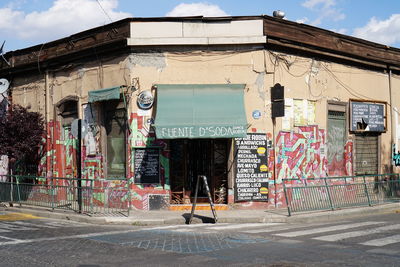 Graffiti on building against sky