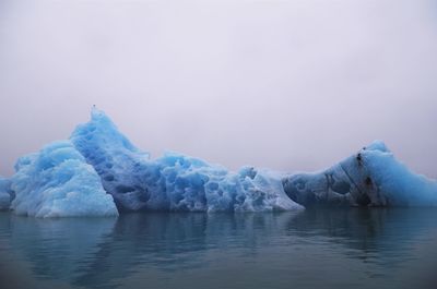 Scenic view of frozen sea against sky