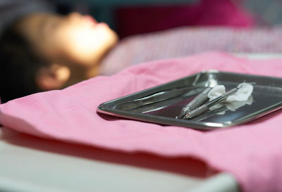 Close-up of dentist equipment on table