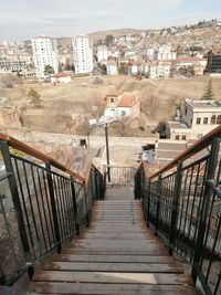 High angle view of steps amidst buildings in city