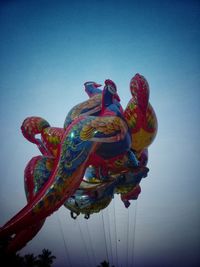 Low angle view of statue against blue sky