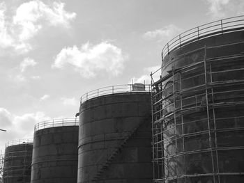 Low angle view of factory against sky