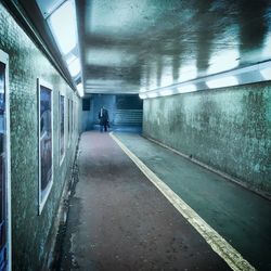 Woman walking in tunnel