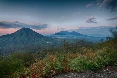 Scenic view of mountains against sky during sunset