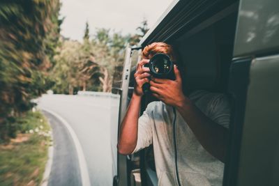 Man photographing car