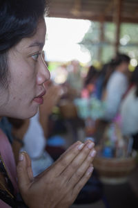 Close-up of woman praying