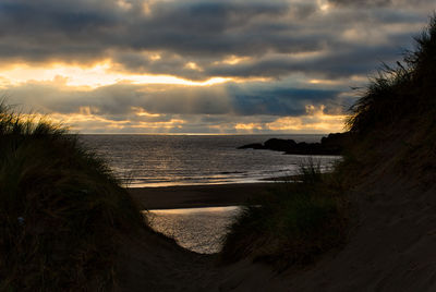 Scenic view of sea against sky during sunset