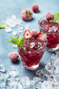 Close-up of strawberries on glass table