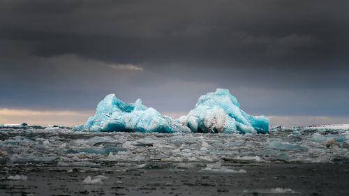 Scenic view of glacier against sky during winter